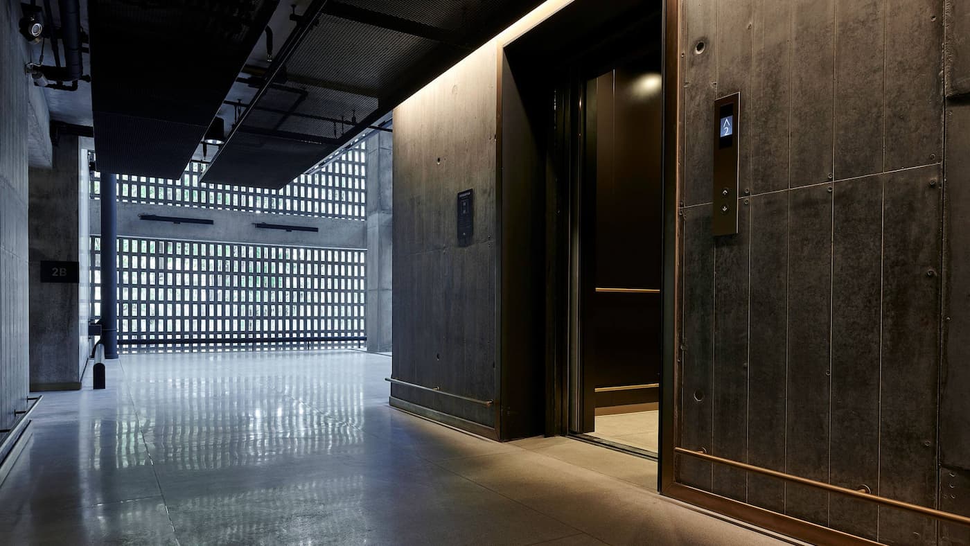 the ribbed walls, brass trim, and cross-ventilation of enlightened upmarket circulation - january 2020